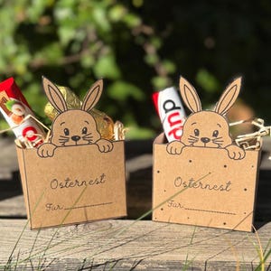 May include: A set of three ceramic nesting bowls in shades of blue, green, and white. The bowls feature a speckled glaze and a simple, modern design. The largest bowl is approximately 7 inches in diameter.