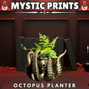 May include: An octopus-shaped planter with a skull design, holding green plants. The planter is bronze-colored and has tentacles wrapping around it. The text "MYSTIC PRINTS" and "OCTOPUS PLANTER" are displayed.