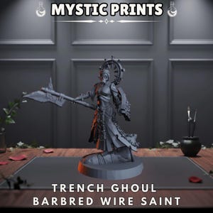 May include: A gray figurine of a character with a gas mask, holding a large axe and shield. The figurine is labeled "TRENCH GHOUL BARBRED WIRE SAINT" with the "MYSTIC PRINTS" logo above. The figure is on a dark surface.