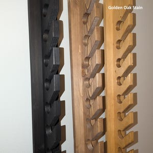 Additional stain options—Black, Walnut, Golden Oak—on the 10-hat wall rack.