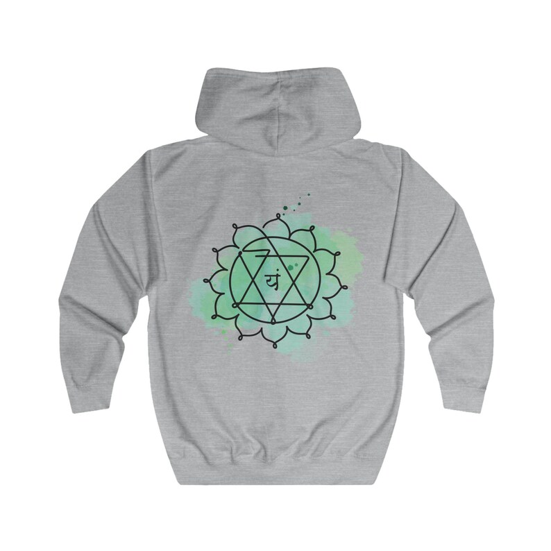 The back of the gray hoodie showcases a large, detailed Anahata chakra design, symbolizing love and balance. Perfect for yoga, meditation, or as a meaningful gift.
