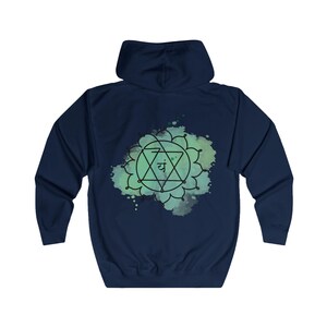 The back of the navy hoodie features a vibrant, large Anahata chakra print, representing love, harmony, and self-healing.