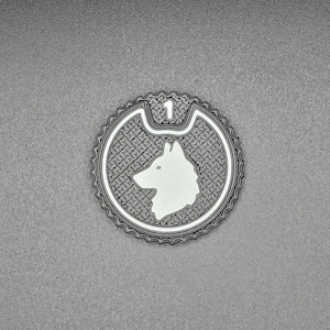 May include: A circular car coaster in black and white, with a husky dog design. The coaster has a textured pattern and the number 1. The background is a textured grey surface.
