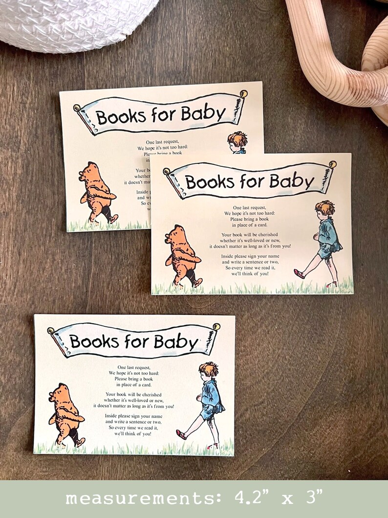 May include: Three identical cards with a light brown background and a white banner that says "Books for Baby". The banner is decorated with a light brown scroll design. Each card features a different illustration of a child character from a children's book. The text on the card reads: "One last request, We hope it's not too hard: Please bring a book in place of a card. Your book will be cherished whether it's well-loved or new, it doesn't matter as long as it's from you! Inside please sign your name and write a sentence or two, So every time we read it, we'll think of you!"