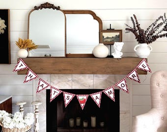 May include: A decorative mantelpiece with a wooden beam, featuring a banner that reads "THAT'S AMORE" in red and white checkered pennants. The mantel is adorned with mirrors, vases, and a bust, creating a cozy, inviting atmosphere.
