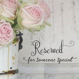 May include: A bouquet of pale pink roses with green leaves in a distressed white metal bucket. The text "Reserved for Someone Special" is written in elegant black script.