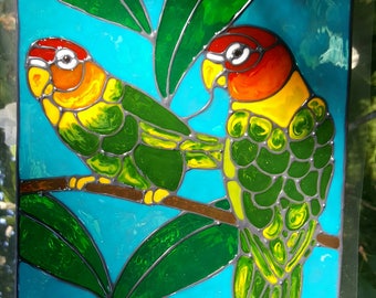 Two lovebirds in a tree jungle window cling