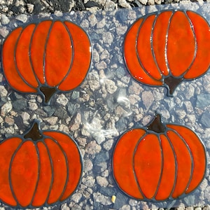 Four pumpkins clings