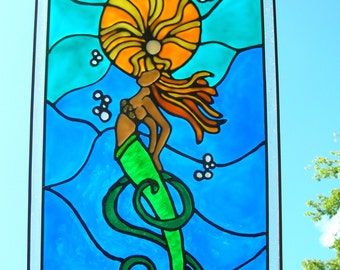 Mermaid shining in the sun stained acrylic glass windows