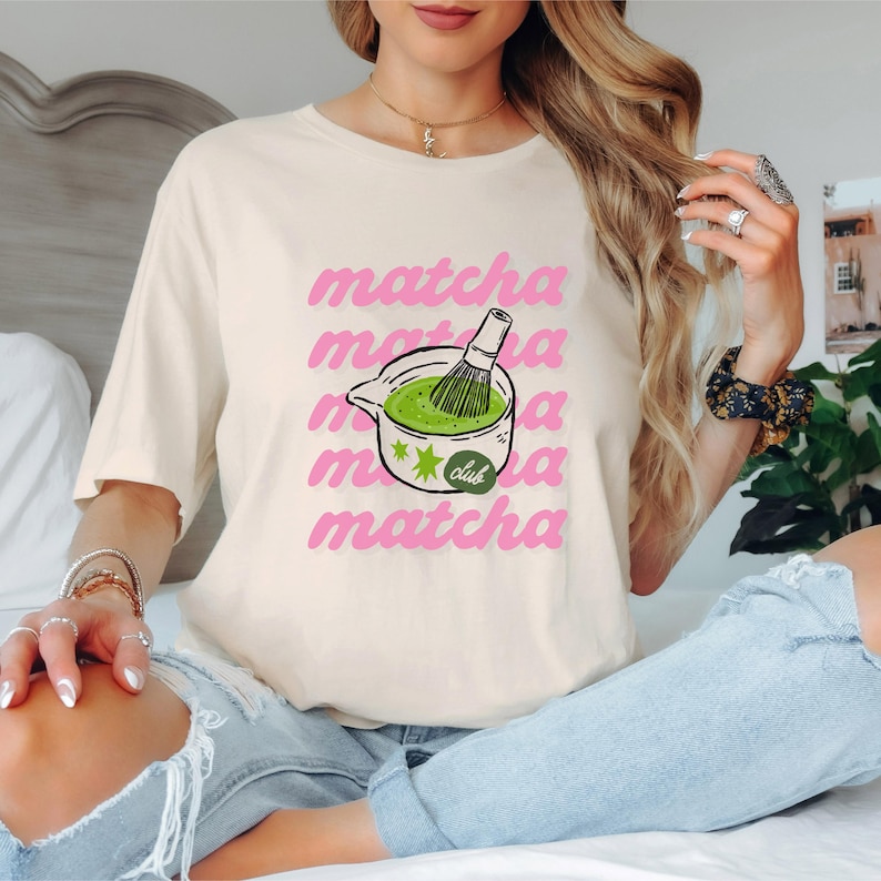 Natural matcha club shirt with playful pink matcha design and green tea illustration, cute cafe aesthetic tee for matcha lovers.
