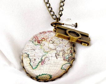 May include: A gold necklace with a vintage world map pendant and a camera charm. The pendant is framed with a gold rim and has a detailed map of the world.