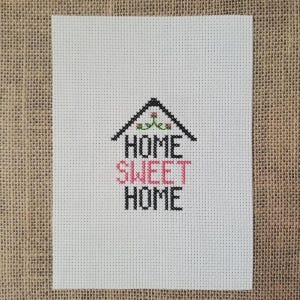 May include: A set of three ceramic mugs with a speckled, matte finish. The mugs are in shades of cream, light gray, and dark gray. Each mug has a simple, minimalist design, perfect for coffee or tea.