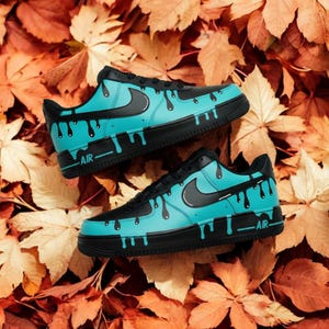 black and turquoise nike air