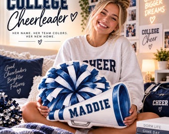May include: A plush pillow shaped like a blue and white megaphone with a matching pom-pom attached, featuring the name MADDIE printed in dark blue block letters on the side of the megaphone, designed as a decorative item for a college student.