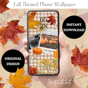 May include: A phone displaying a fall-themed wallpaper with a pumpkin, camera, and autumn leaves. The screen shows the date "05 28" and the words "Fall Themed Phone Wallpaper", "Instant Download", and "Original Design". The background includes fall leaves.