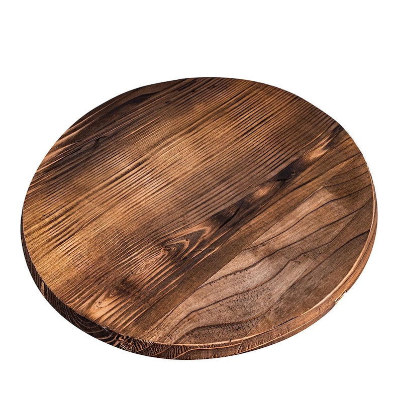 May include: A round wooden serving tray with a dark brown wood grain finish. The tray is made of natural wood and has a rustic look.