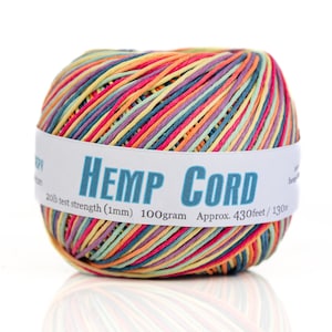 May include: A ball of colorful hemp cord with a white label that reads "HEMP CORD 20lb test strength (1mm) 100gram Approx. 430feet/130円"