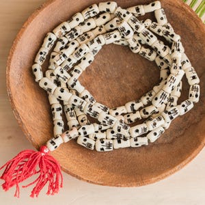 Carved Bone Skull Beads, 108 Mala beads with  Red tassel,  26 Inch Strand  -B3334