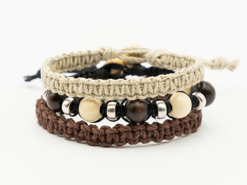 Handmade  hemp surfer  bracelets, set of 3, made with natural  hemp cord, wood and  metal beads.  The bracelet can be made   with either a bead and loop clasp, slider knot  or loose ends to tie.