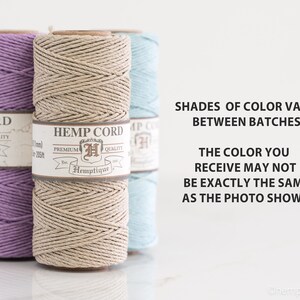 May include: Three spools of hemp cord in lavender, natural, and light blue. The spools are labeled "Hemp Cord" with the brand name "Hemptique". The text "Shades of color vary between batches" and "The color you receive may not be exactly the same as the photo shows" is printed below the spools.