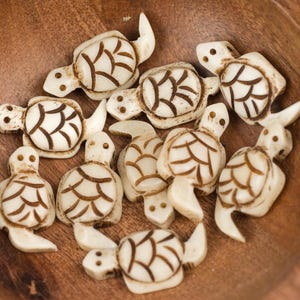 Carved Ox Bone Turtle Pendants: Small Bone Jewelry Charms (4 Pieces)