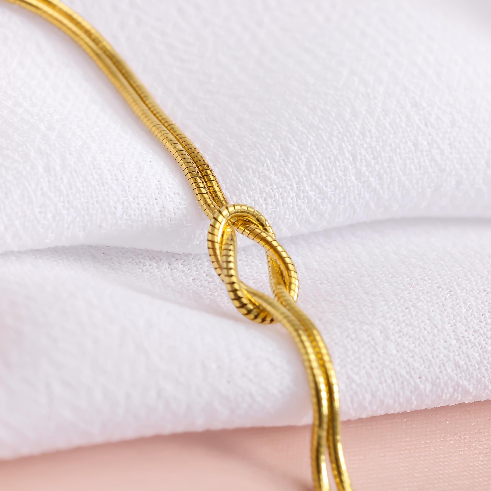 Bracciale con nodo riempito in oro 14k con catena a serpente