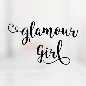 May include: Black and white calligraphy text that reads "glamour girl" on a white background.
