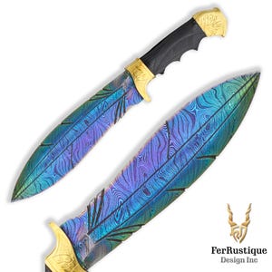 May include: A handcrafted knife with a blue and purple iridescent Damascus steel blade and a black handle with gold accents. The blade has a feather pattern and the handle has a floral design. The knife is displayed on a white background.