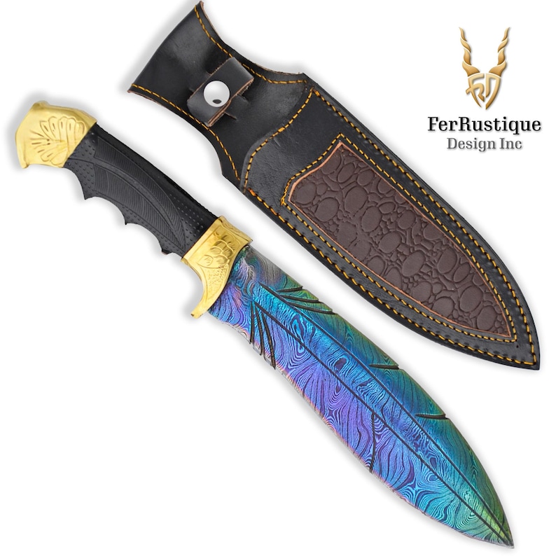 May include: A blue and purple iridescent knife with a gold handle and a black leather sheath. The knife has a feather design on the blade. The sheath has a brown leather lining with a textured pattern.
