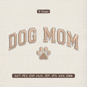 May include: An embroidered design with the words "DOG MOM" in a beige, collegiate-style font, and a paw print beneath. The design is on a textured, off-white background. The text "9 Sizes" is above the text, and "DST, PES, EXP, HUS, JEF, VP3, XXX, EMB" is below.