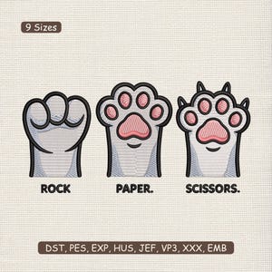 May include: An embroidered design showing three hand gestures: rock, paper, and scissors, each styled as a cat paw. The rock is a fist, paper is an open paw, and scissors is a paw with two points. The text "ROCK", "PAPER.", and "SCISSORS." are below each image.