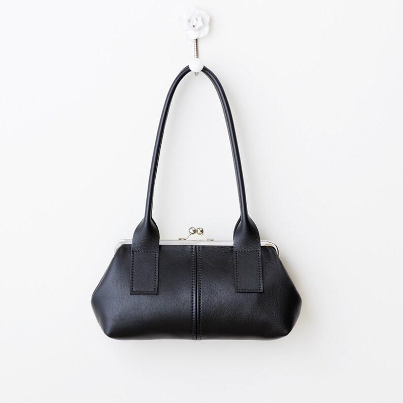 leather kiss lock handbag