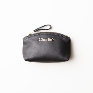 Small personalized leather clutch.