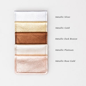Set of five metallic leather credit card wallets in a variety of colors with text describing leather color options.