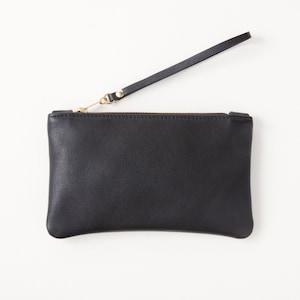 Black leather zipper clutch with wrist strap top view.