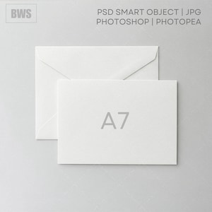 May include: A white A7 card and envelope set. The card has the text "A7" printed in gray. The envelope is behind the card. The image also contains the text "PSD SMART OBJECT | JPG PHOTOSHOP | PHOTOPEA".