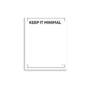 May include: A white rectangular print featuring a thin black border frame. The text KEEP IT MINIMAL is printed in black capital letters at the top center. A small black smiley face emoticon is positioned in the bottom right corner of the frame.