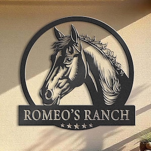 May include: Black metal sign with a horse head silhouette and the text "ROMEO'S RANCH" with five stars below.