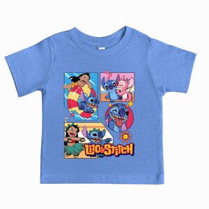 May include: A light blue short-sleeve t-shirt featuring a graphic print of Lilo and Stitch characters in various scenes. The design includes Lilo and Stitch on a float, Stitch with Angel, a close-up of Stitch, and Lilo dancing with Stitch.