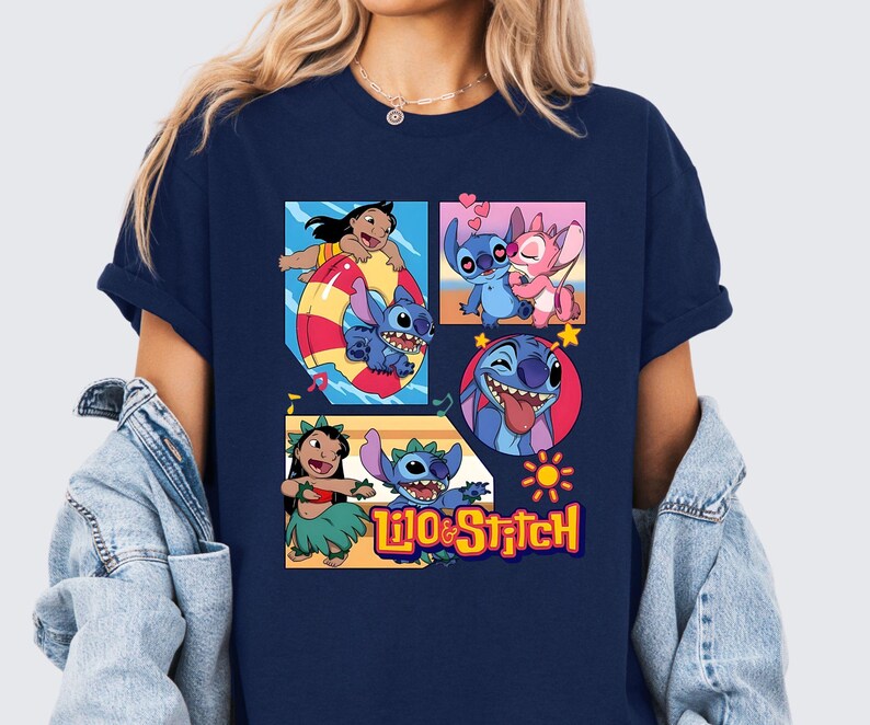 May include: A navy blue short-sleeve t-shirt featuring a graphic print of Lilo and Stitch characters in various scenes, including swimming, dancing, and heart motifs, with the text Lilo & Stitch printed in yellow at the bottom of the design.