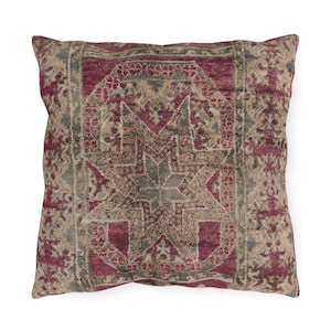 May include: Square decorative pillow with a vintage-style design. The pillow features a central star pattern in shades of burgundy, beige, and gray. The overall design has a distressed, antique appearance, suitable for home decor.