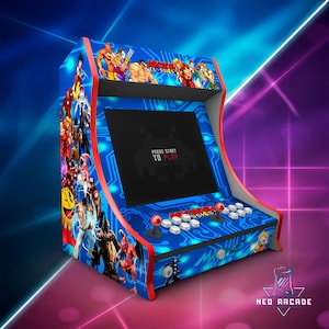May include: A blue arcade machine with red accents, featuring a screen displaying "PRESS START TO PLAY." The cabinet is decorated with colorful illustrations of classic video game characters and the text "NEO ARCADE CLASSICS."