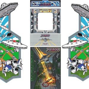 May include: A set of arcade cabinet side art and control panel graphics featuring the Xevious game theme. The design includes blue, green, and grey colours with illustrations of spaceships, flying saucers, and ground targets with the text Xevious.