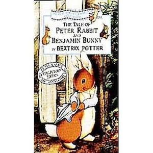 May include: A vintage book cover featuring the title "The Tale of Peter Rabbit and Benjamin Bunny" by Beatrix Potter. The illustration shows a rabbit holding an umbrella. A "Collector's Series" seal is also visible.