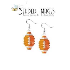 May include: A pair of beaded earrings shaped like footballs. The footballs are orange and white with a black stitching detail. The earrings are hanging from silver hooks.