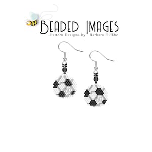 May include: A pair of silver beaded earrings with a black and white soccer ball design. The earrings are hanging from silver hooks.