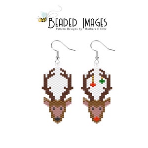 May include: A pair of beaded earrings featuring a reindeer design. The reindeer has brown antlers, a brown face, and a red nose. The earrings are white with a brown outline and are attached to silver hooks.