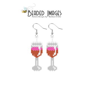 May include: A pair of beaded earrings shaped like wine glasses with pink and orange beads. The earrings are silver and have a hook closure.