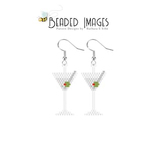 May include: A pair of silver beaded earrings shaped like martini glasses with green olives. The earrings are hanging from silver hooks.