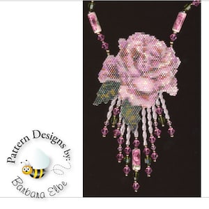 May include: A pink beaded rose necklace with a green beaded stem and leaves. The necklace has a beaded fringe with pink and green beads.